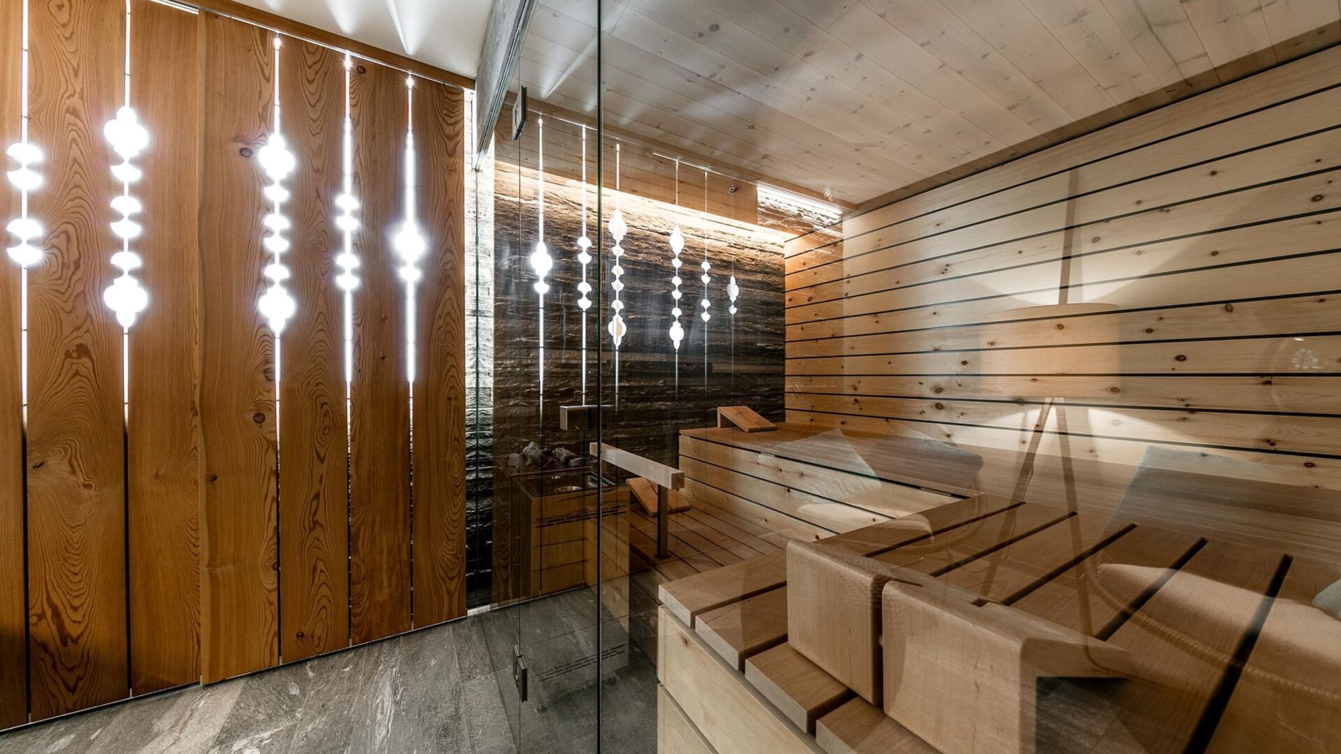 Kueng sauna wellness indoor kokon valserquarzit arvenholz 15